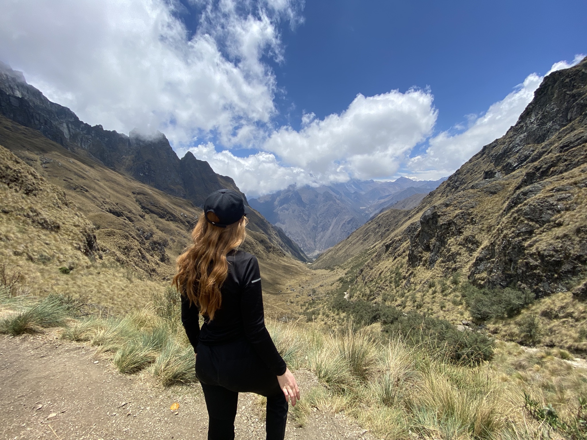 The Complete Inca Trail Hike Guide for Beginners A woman hiking in the Andes Mountains on the Inca Trail Hike in Peru