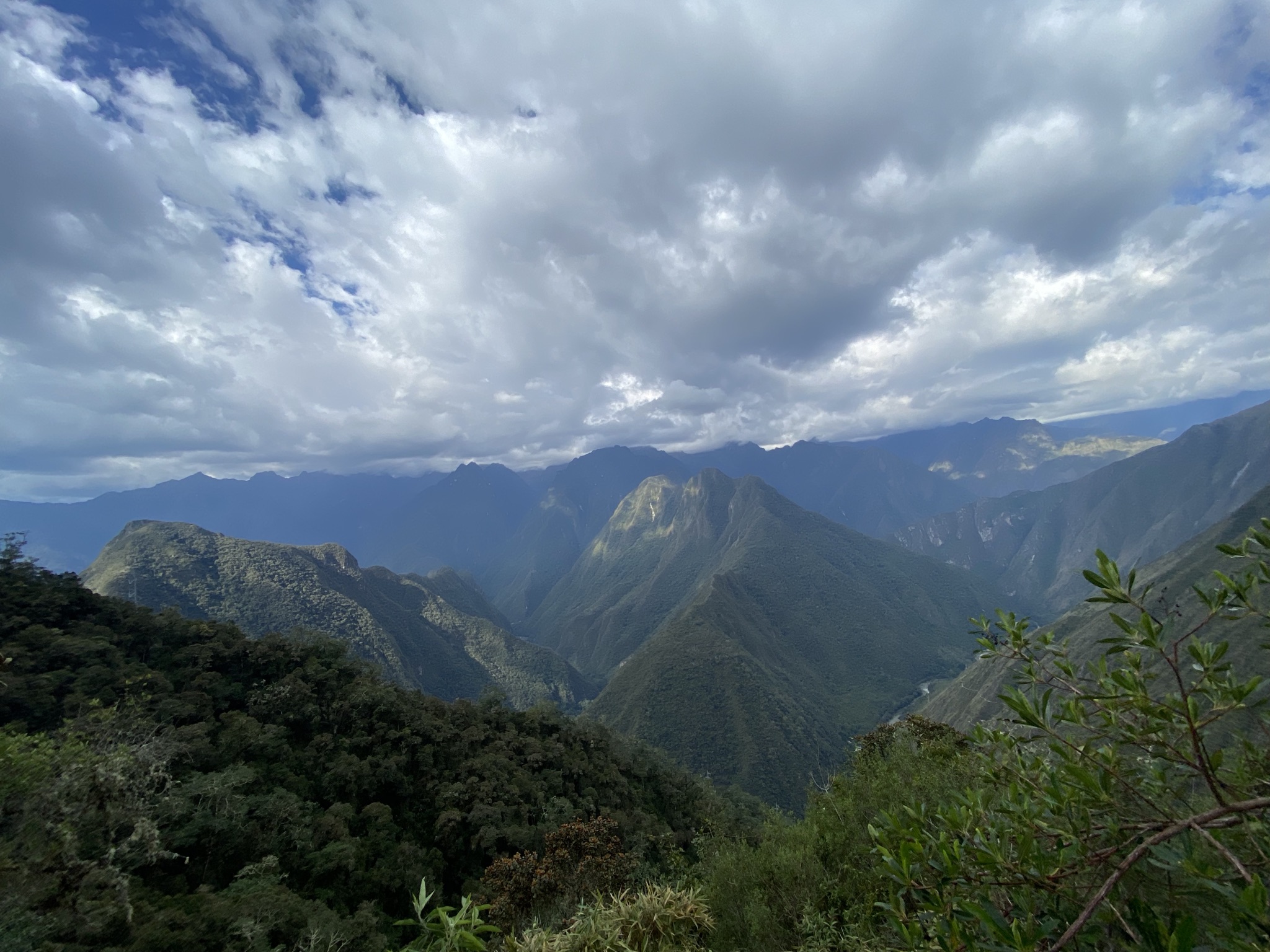 The Complete Inca Trail Hike Guide for Beginners A mountain landscape part of the Inca Trail in the Andes Mountains of Peru