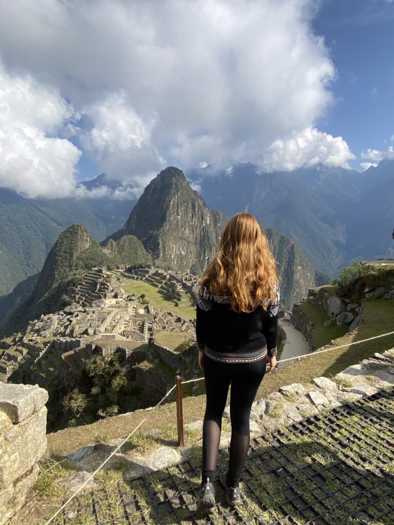 The Complete Inca Trail Hike Guide for Beginners A woman staring a Machu Picchu in Peru