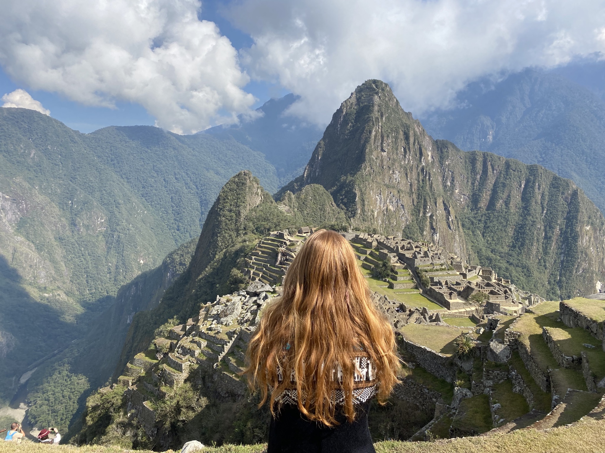 The Complete Inca Trail Hike Guide for Beginners A woman is staring at Machu Picchu after completing the Inca Trail Hike
